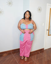 Plus size model wearing pink and blue two piece pant set front view