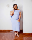 LYSAIRE Amara Bow Back Midi Dress in powder blue styled with silver heels and evening accessories.