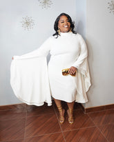 Plus size white midi dress with dramatic angel sleeves