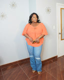 Plus size coral blouse with adjustable tie neckline styled with denim full body look