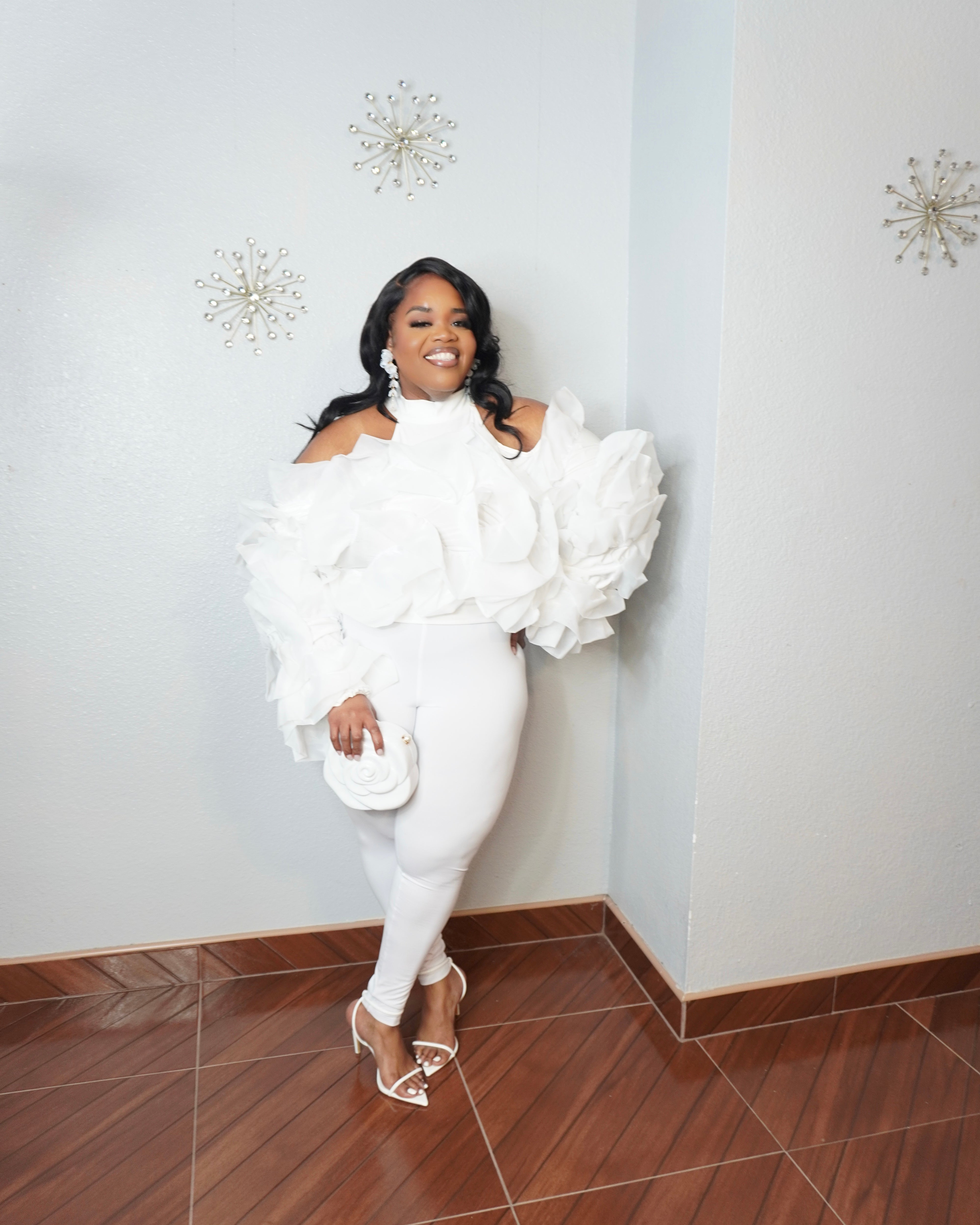 Curvy woman wearing elegant white floral blouse