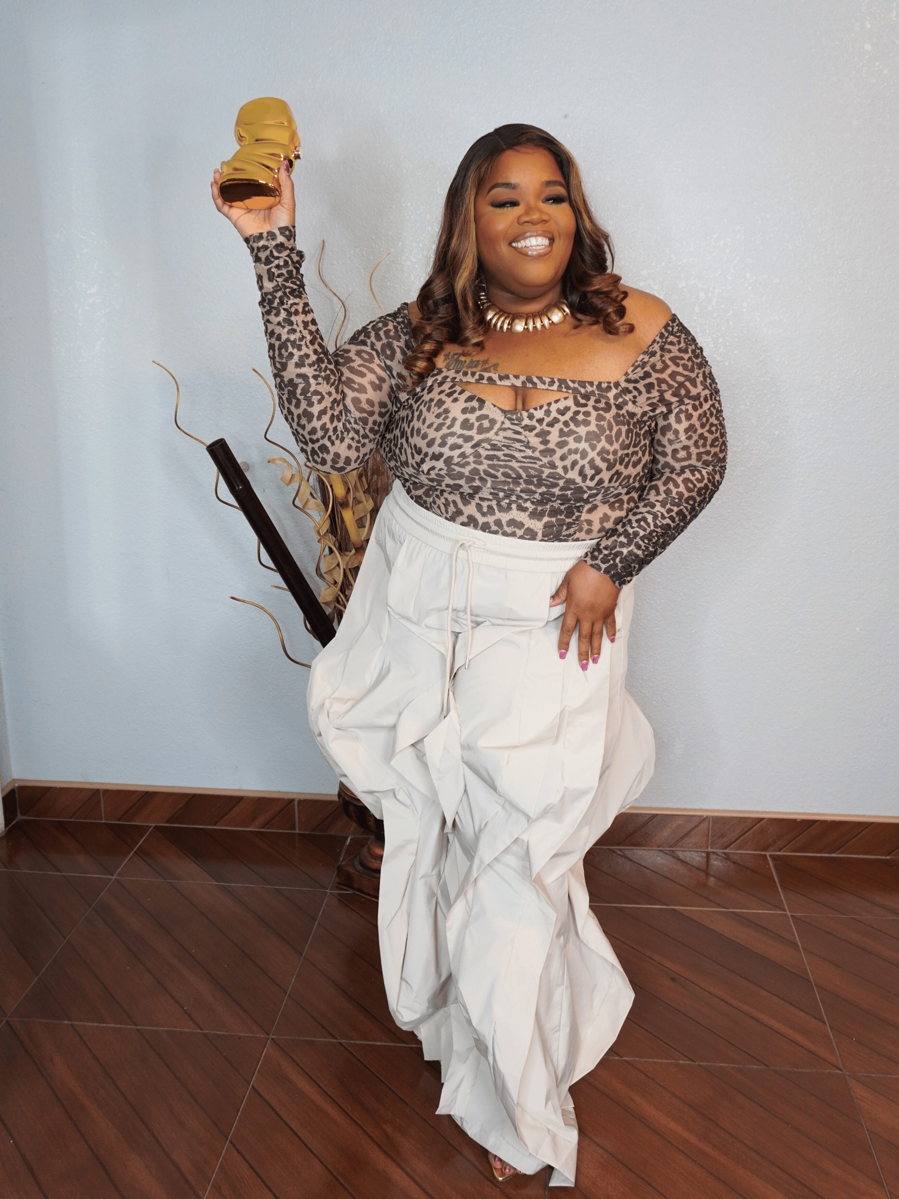 Oversized flowy statement pants for plus size women with elastic waistband styled with leopard top