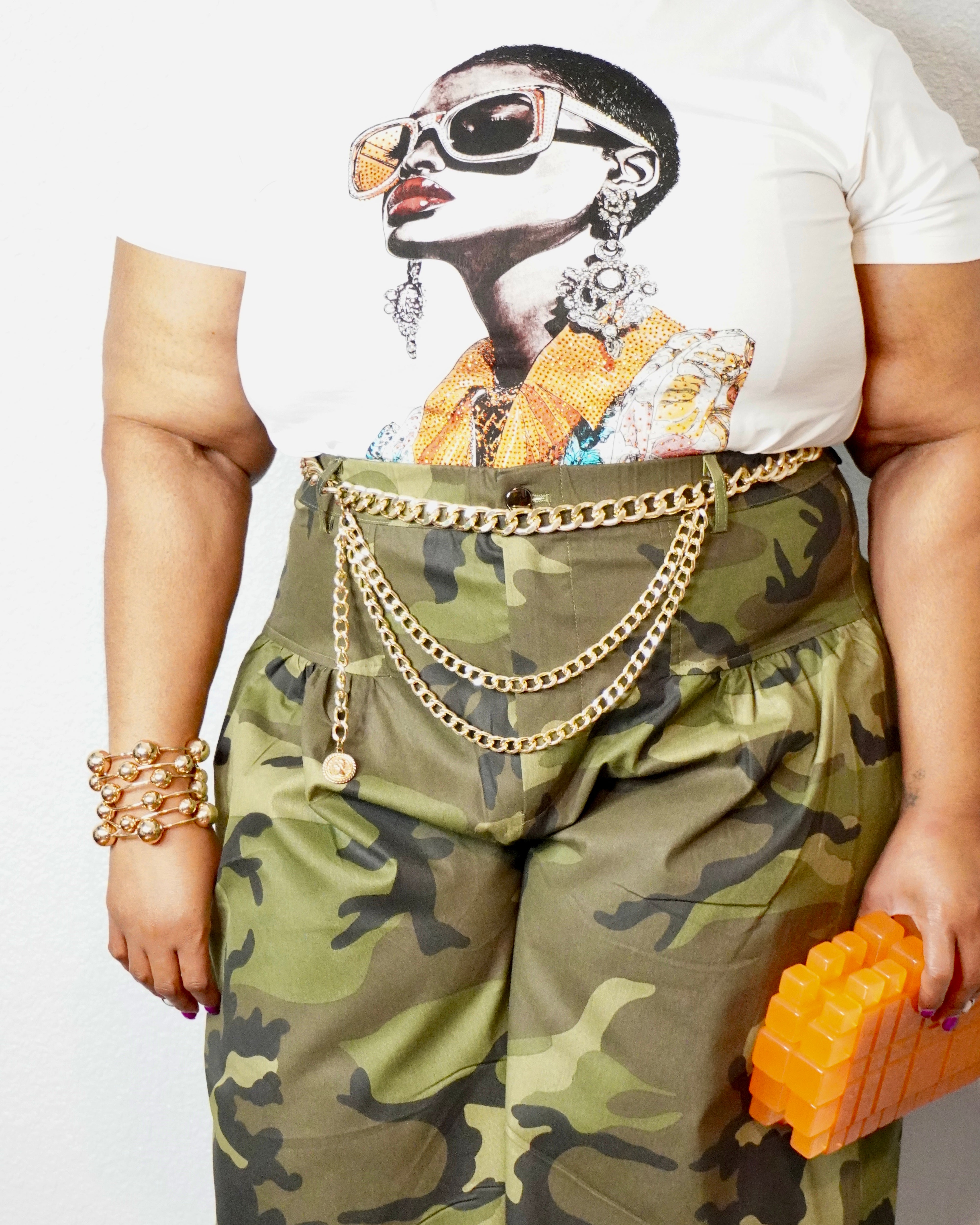Close-up of Lysaire olive camo plus size wide leg pants with high waist pockets and camouflage print