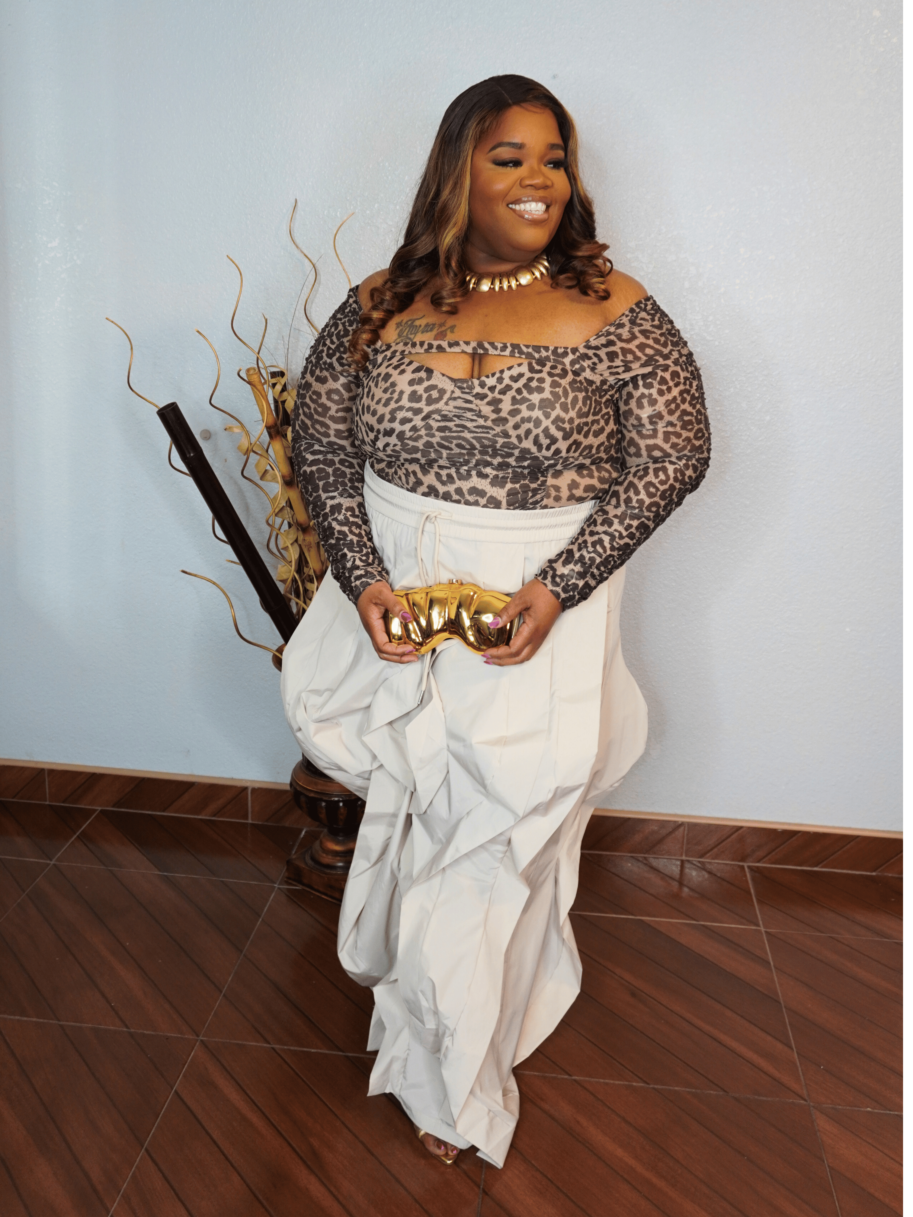 Oversized flowy statement pants for plus size women with elastic waistband styled with leopard top