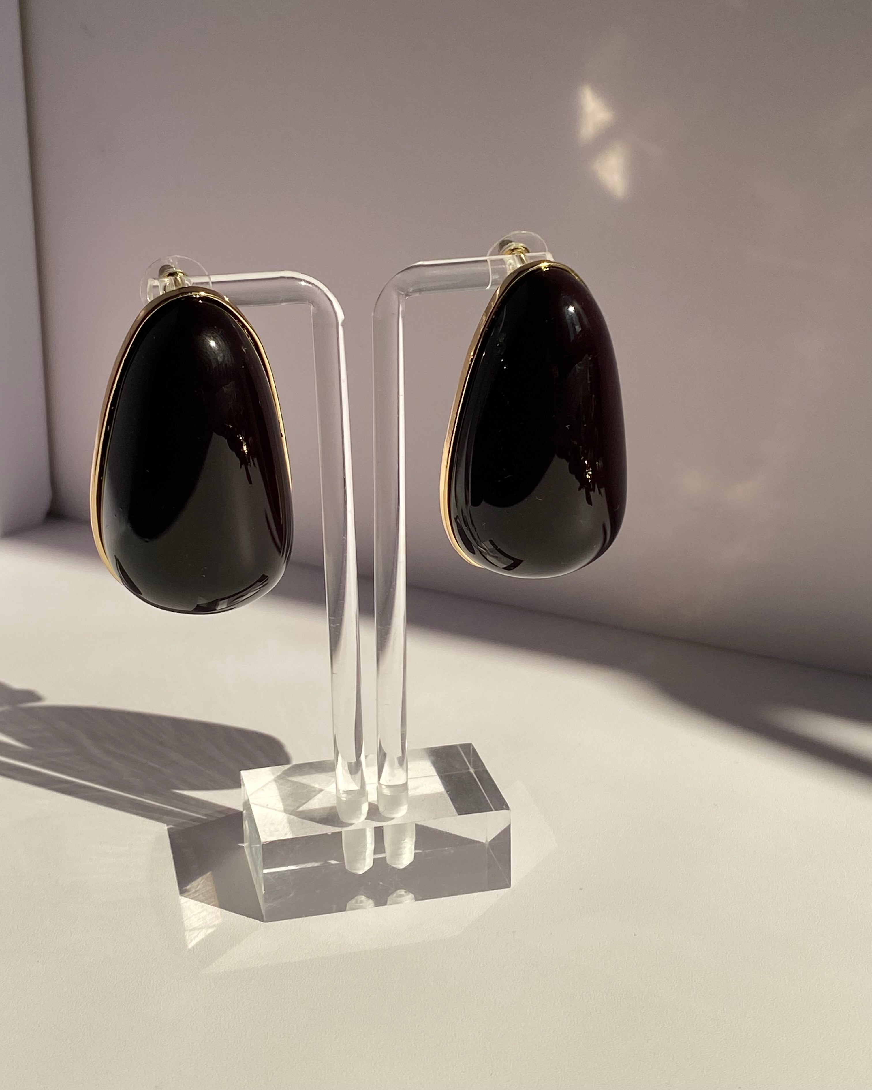 Black and ivory oversized teardrop statement stud earrings with gold-tone borders available at Lysaire