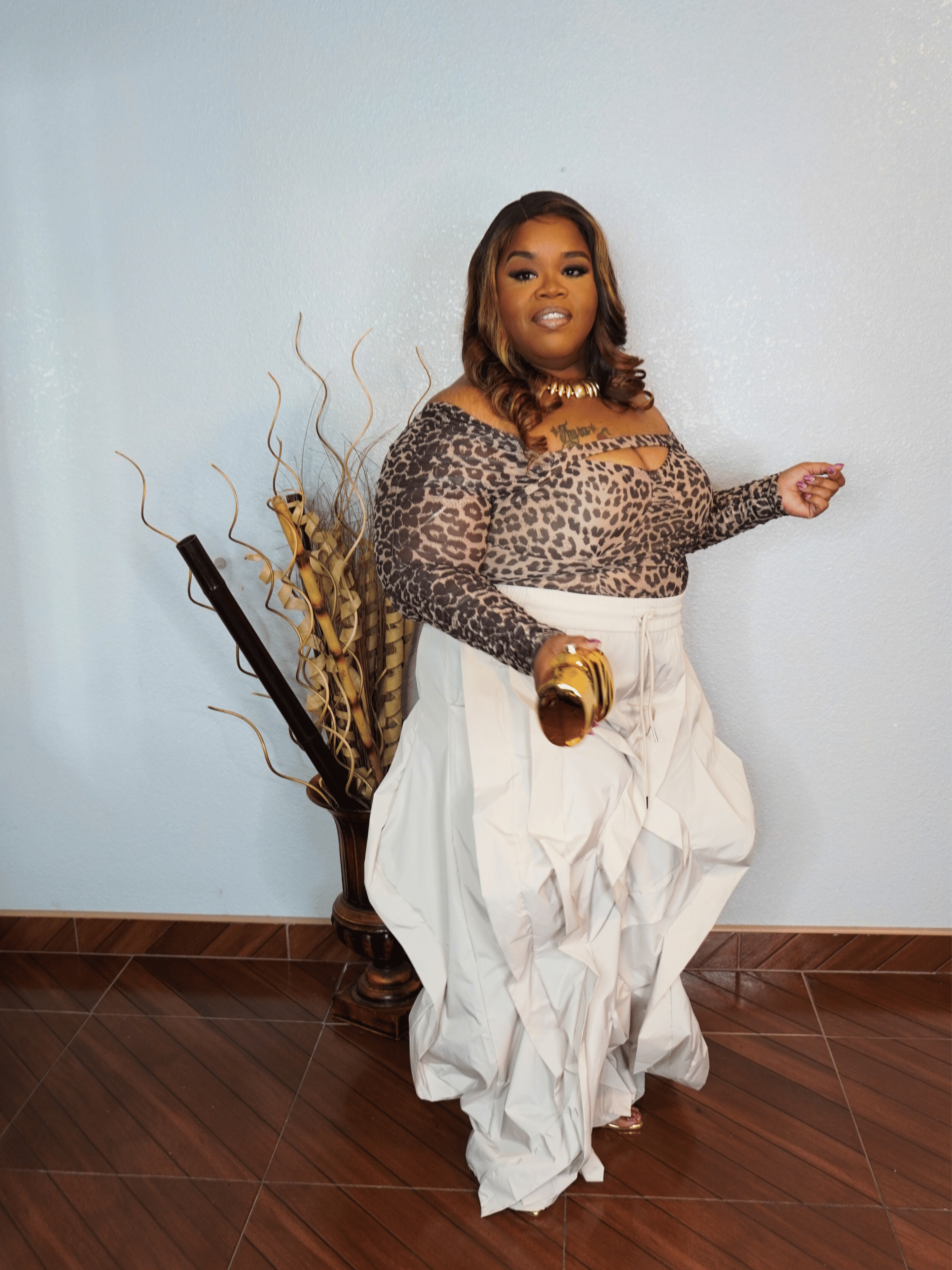 Oversized flowy statement pants for plus size women with elastic waistband styled with leopard top