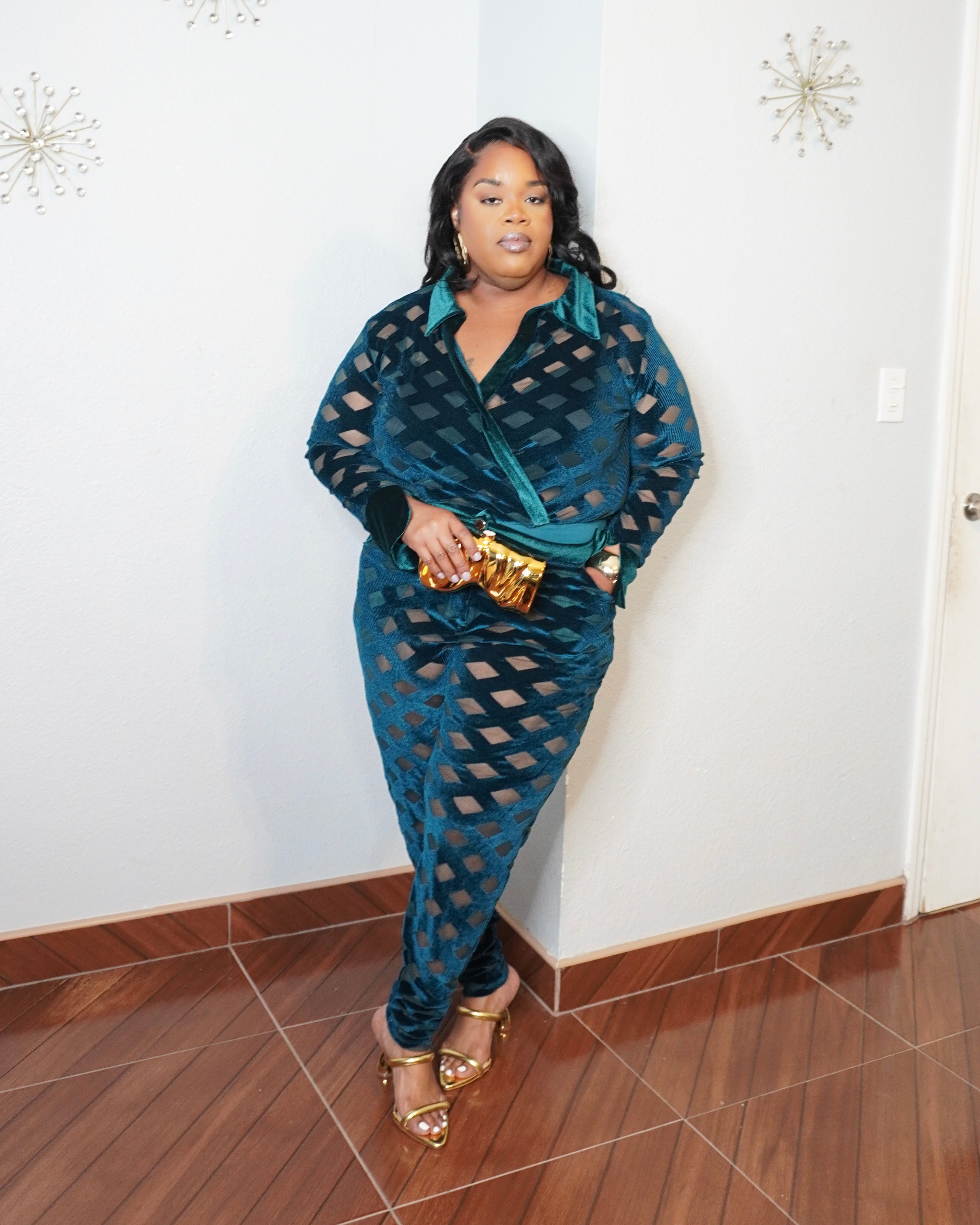 Plus size model wearing emerald mesh two piece set with high waisted pants and long sleeve bodysuit