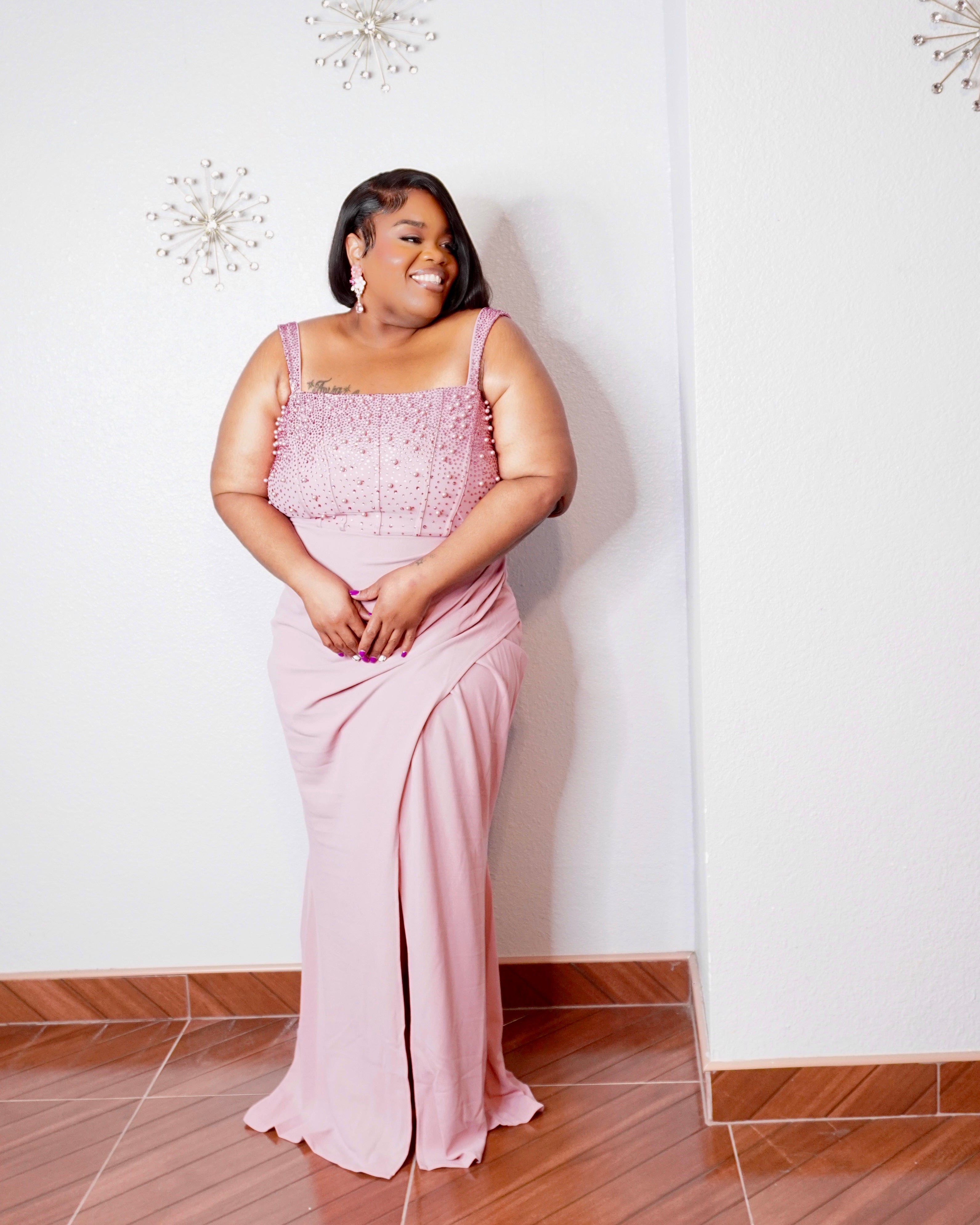Back view of the Rosé Royale dusty pink plus size formal maxi dress from LYSAIRE, displaying the elegant square-back neckline, embellished shoulder straps, fitted upper bodice, center-back zipper closure, and smooth floor-length skirt for a sophisticated evening gown silhouette.