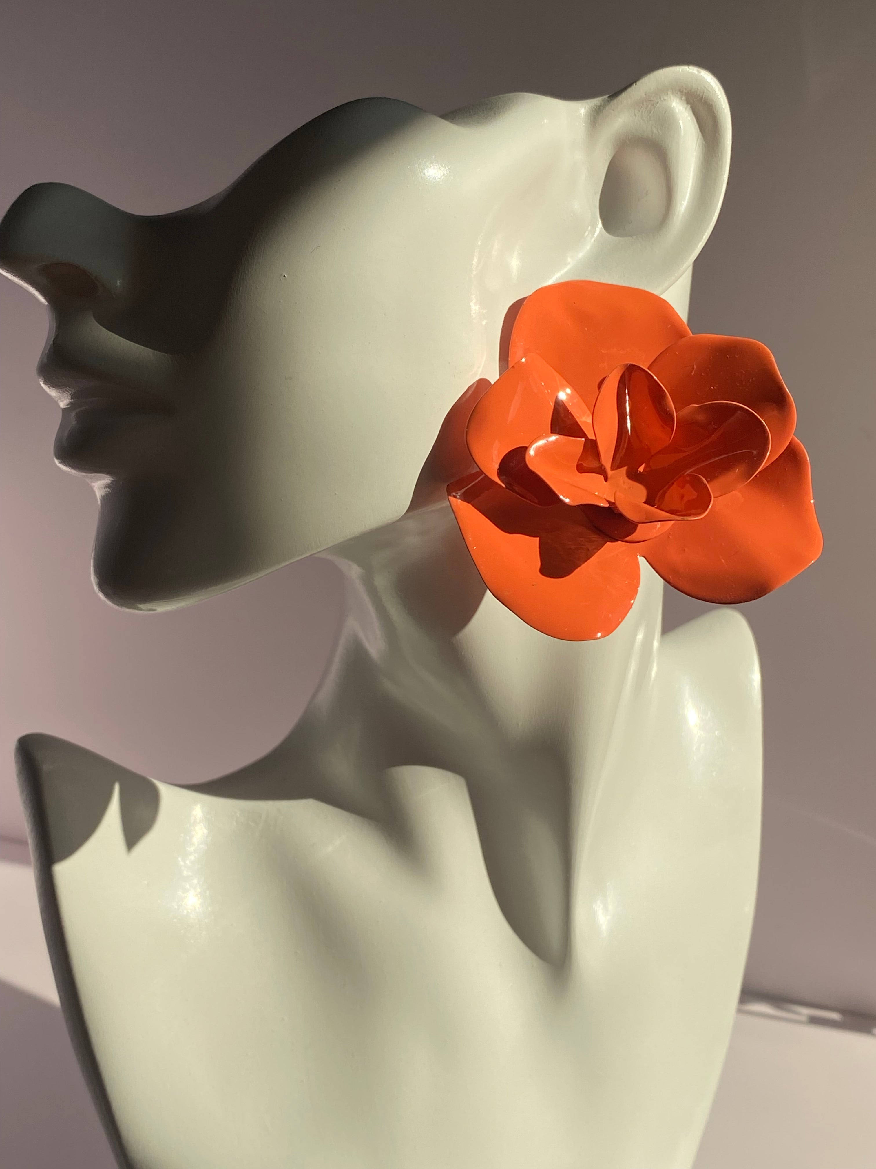 Large vibrant orange floral statement earring with layered sculptural petals and glossy finish from Lysaire boutique