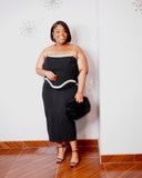 Elegant plus-size black midi dress featuring crystal-style embellished neckline and sculpted corset-inspired bodice.